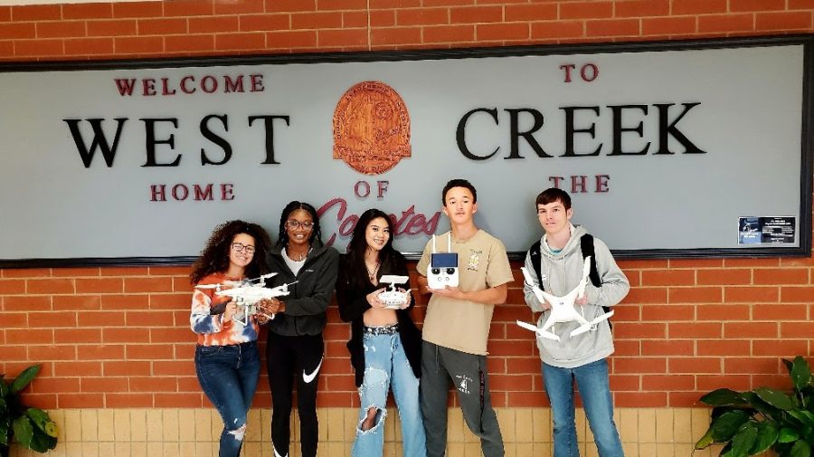 Melianys Rodriguez, Keira Oxendine, Kaitlyn Pham, Andre Logan and Nathaniel Tyler pose with the drones. 