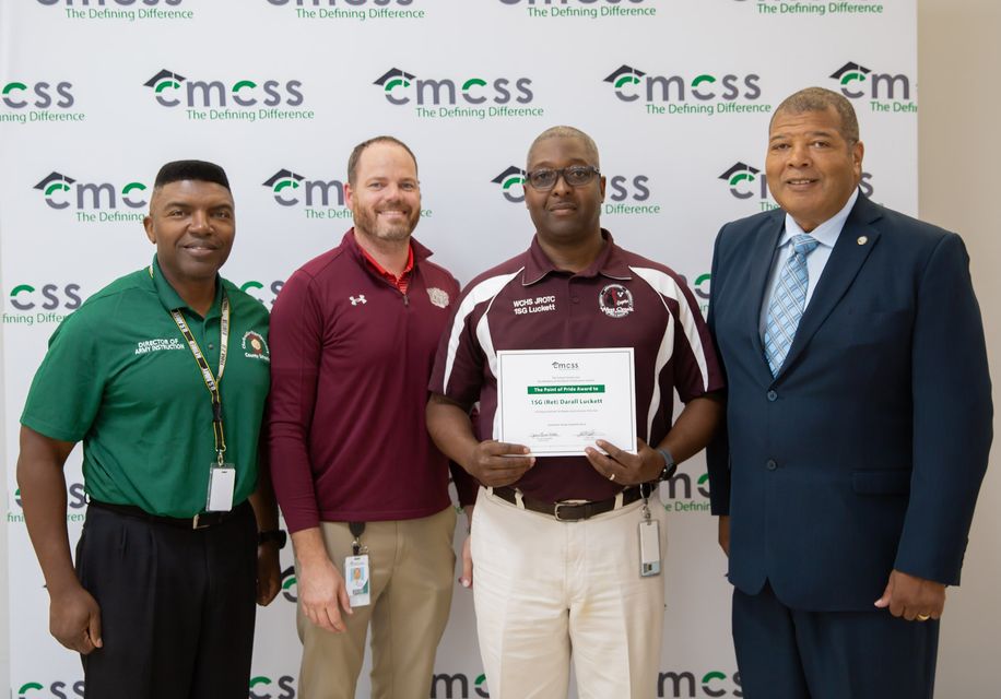 First Sgt. Luckett was presented a Point of Pride Award at the Sept. 19 CMCSS School Board Meeting. With him is Colonel Vernon Lightner, Director of Army Instruction; Dr. Will Ferrell, principal of West Creek; and Herbert A. Nelson, school board member 