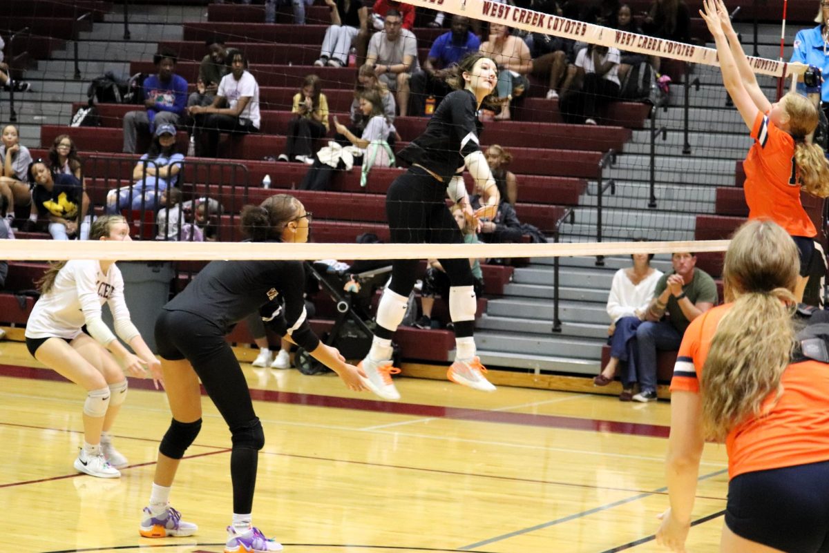 Olyvia Holloway spikes a ball against Kirkwood on Sept. 25. She was named First Team All-County.