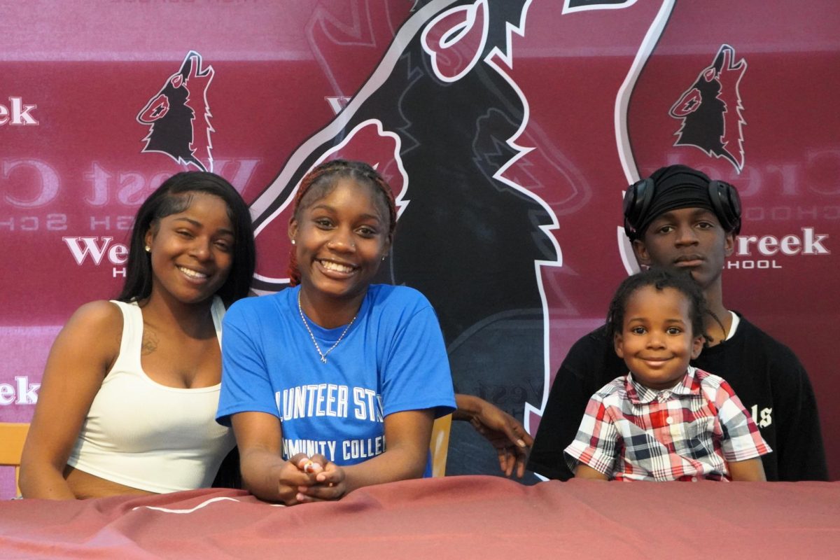 Senior Madzi Calloway (center) signed with Volunteer State Community College to play basketball. With her are her aunt, brother and cousin LaFrederick.