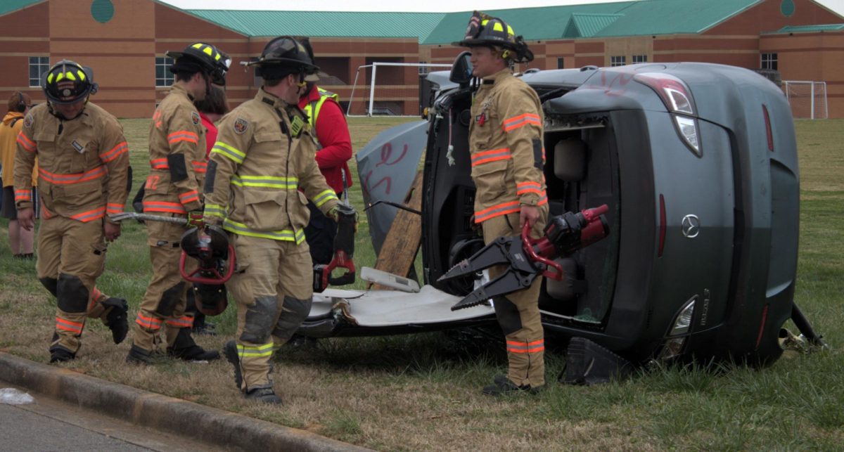 Firemen use the jaws of life to open the roof of a car during the criminal justice demonstration on March 22, 2024.