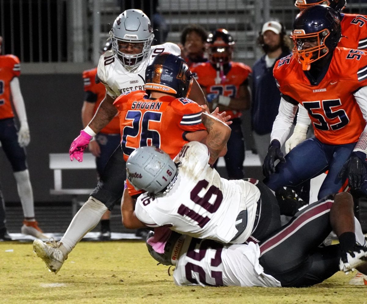 Senior Kingston Leon (#16) drags a Kirkwood runner to the ground during the game on Nov. 1.