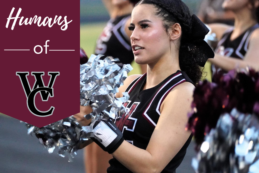 Senior cheerleader Aeriona Cockran cheers during a football game.