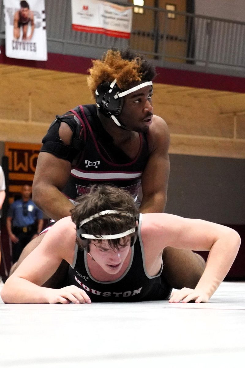 Senior Standford Thompson takes down a Houston High School wrestler during the team sectionals on Jan. 25, 2025.