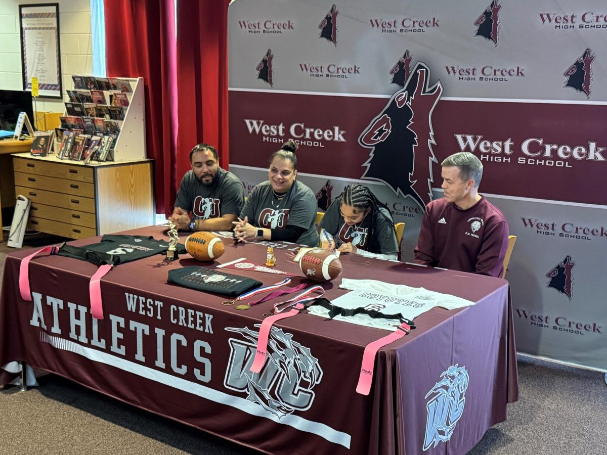 Senior Leilyn Mercado signs her letter of intent to play flag football at Campbellsville University on Tuesday, Feb. 18, 2025.